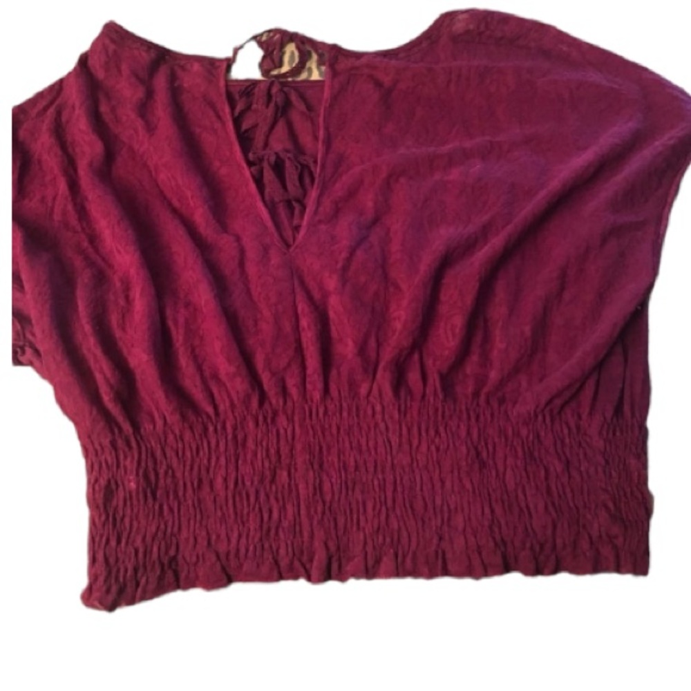 Free People size medium dark pink top with open back runs large NWT